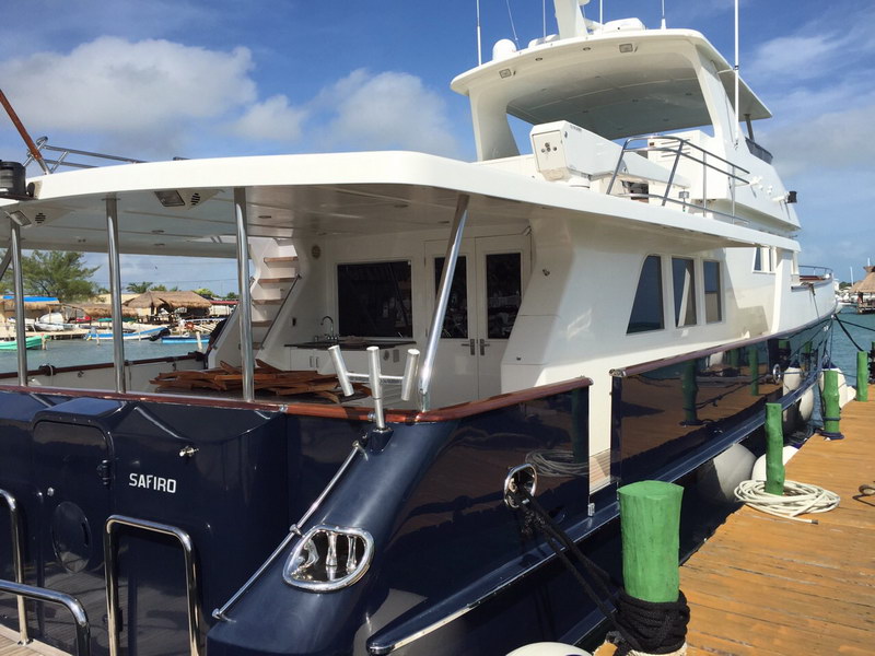 Australis 78 ft classic yacht flybridge and upper deck with panoramic views over turquoise Caribbean sea Cancun