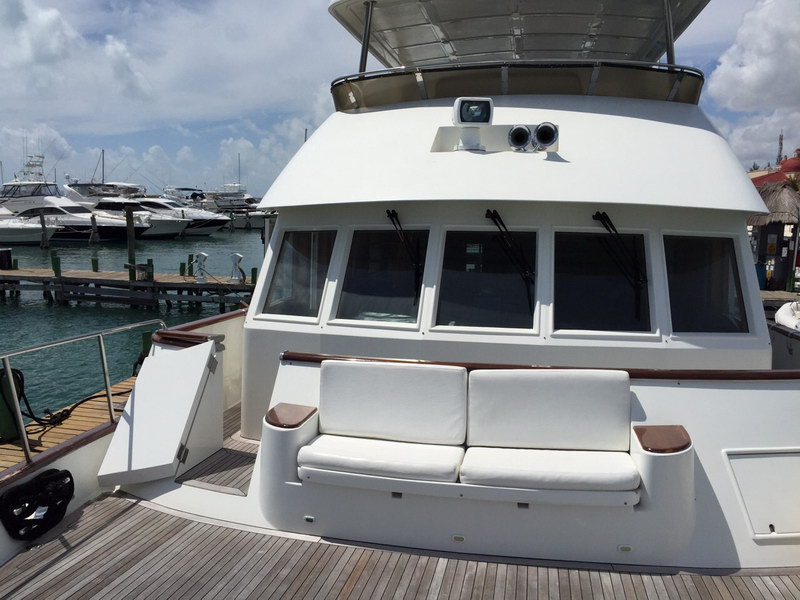 Australis 78 ft yacht dining area and galley for gourmet meals during private Caribbean charter Cancun Mexico