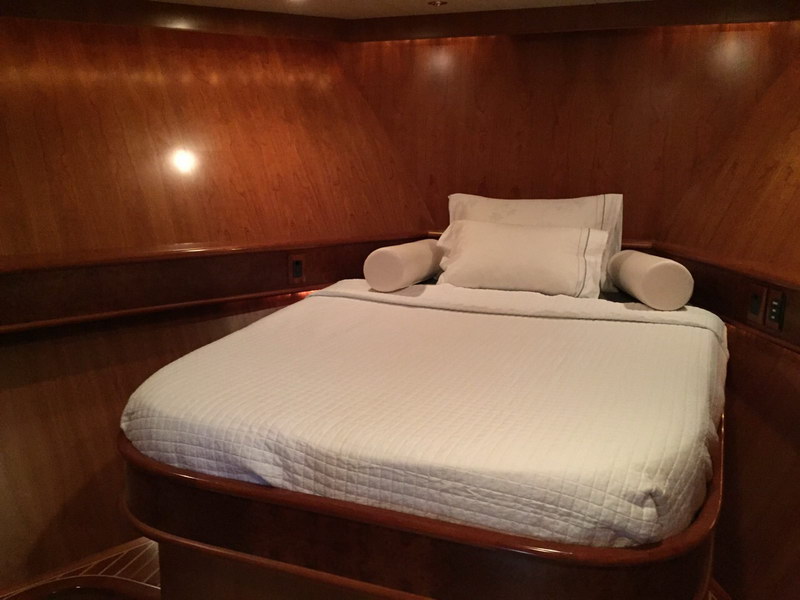 Australis 78 ft yacht side profile moored showing classic white and dark hull design, charter boat Cancun