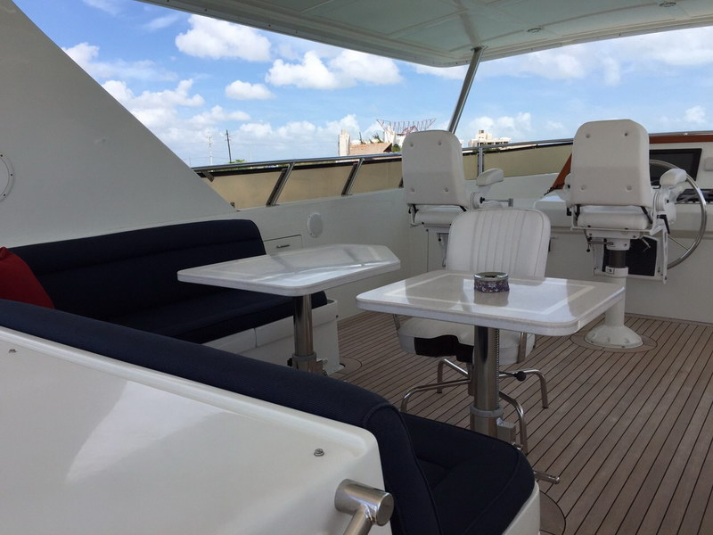 Australis 78 ft luxury yacht cruising near Cancun islands with guests aboard enjoying Caribbean sunshine