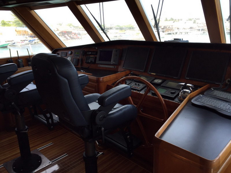 Australis 78 ft classic charter yacht at Cancun marina showing full profile ready for private group departure