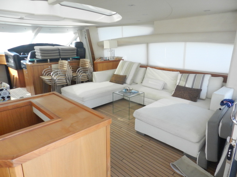 Sunseeker 82 Predator luxury yacht stern view at Caribbean marina, perfect for photo shoots and TV productions