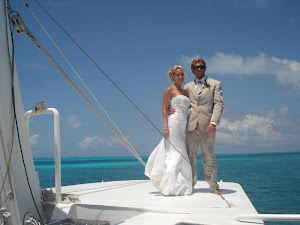 Wedding ceremony decor and place settings arranged on the Discovery boat for a celebration at sea off Cancun