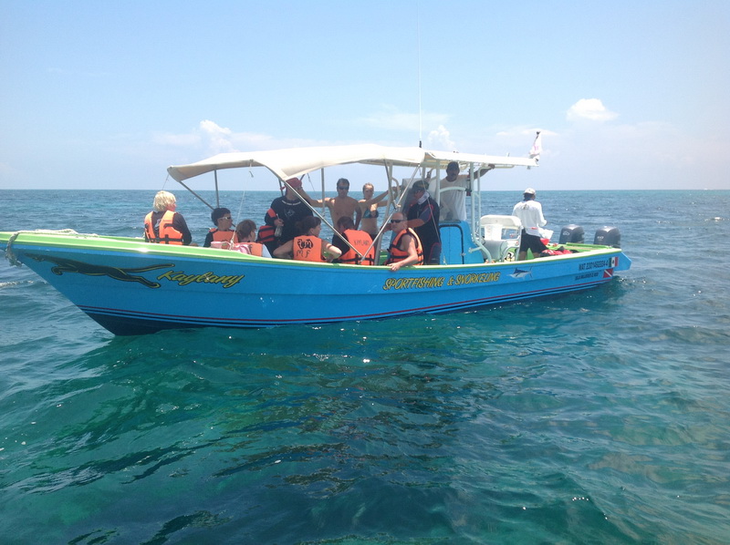 Private boats and yachts moored in the turquoise water off Isla Mujeres, ready for island tours and fishing from Cancun