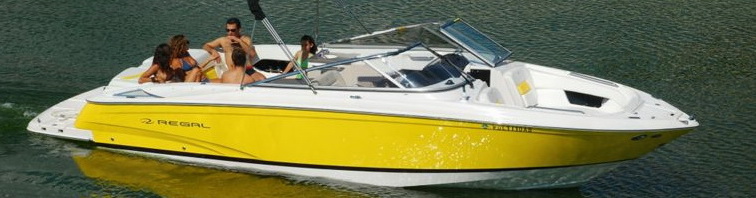 Yellow 27 ft Regal sport boat with guests cruising on calm water — private boat charter Puerto Aventuras Riviera Maya