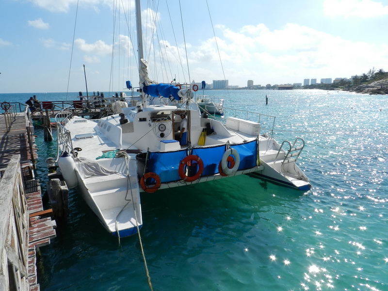Group of passengers aboard the Catamaran Tiger on a private sailing charter near Isla Mujeres, Cancun